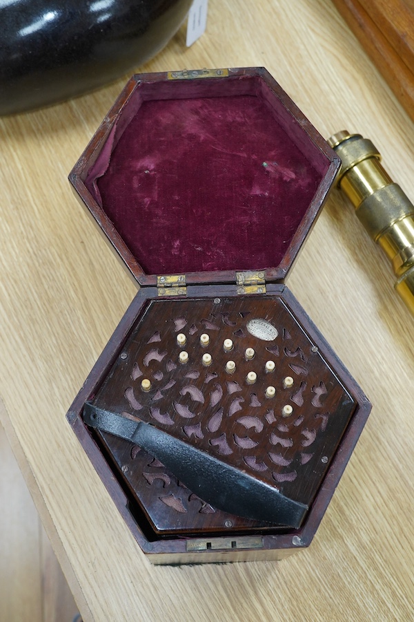 A mid-19th century Lachenal & Co., London mahogany concertina, in an hexagonal mahogany case. Condition - fair to good, the leatherwork on the bellows appears sound and strong.